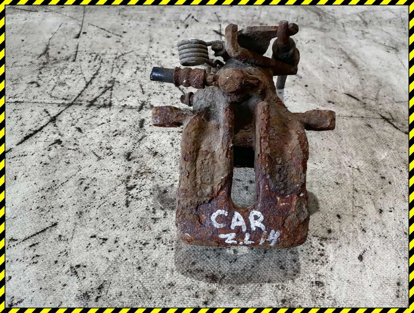 Суппорт задний левый к Mitsubishi Carisma 1996