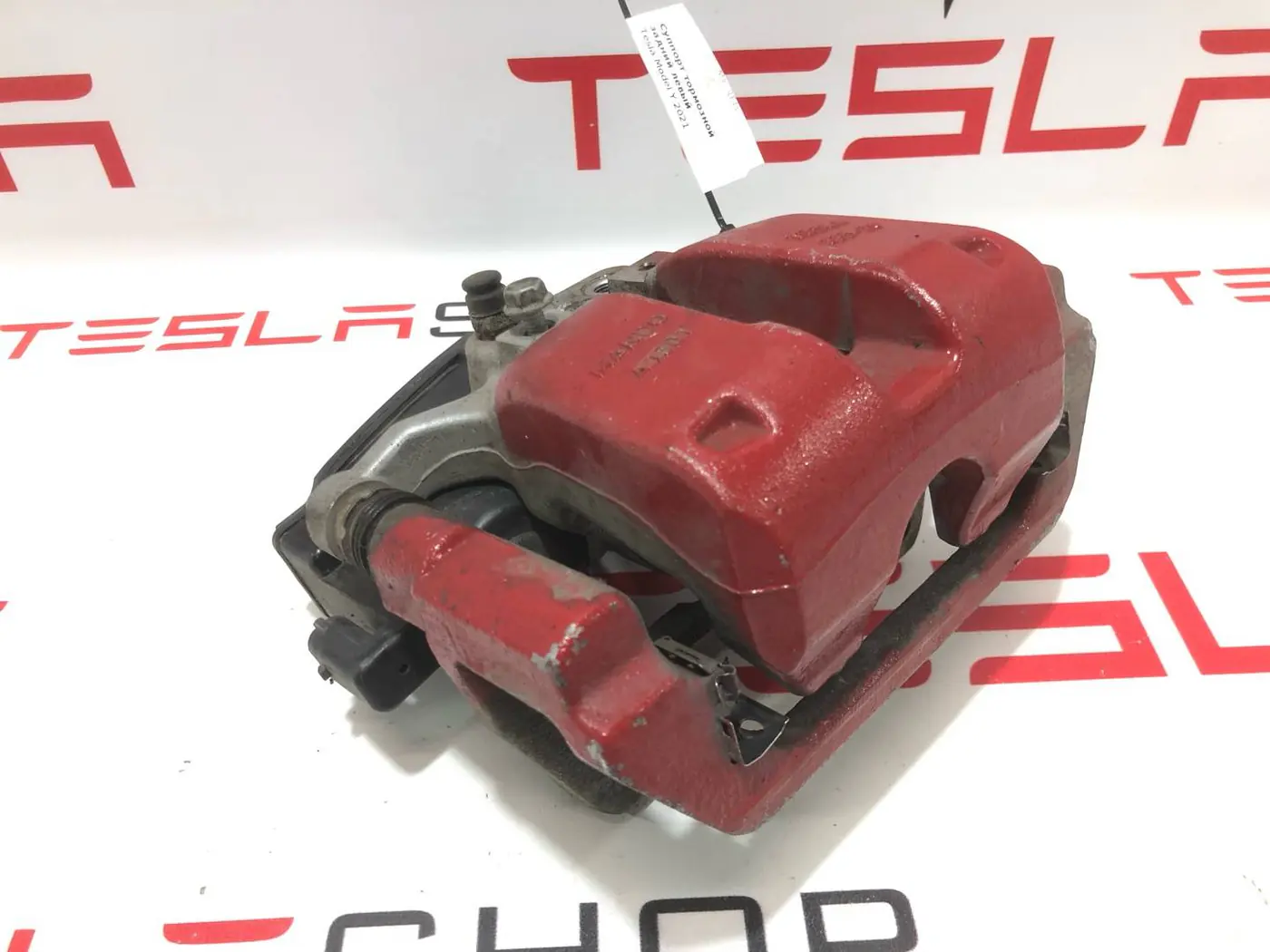Суппорт задний левый к Tesla Model Y 2021