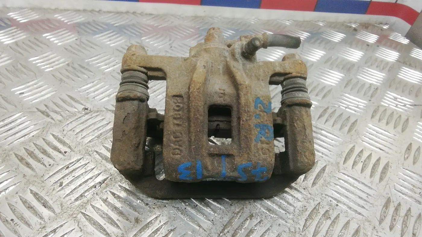 Суппорт задний левый к Chevrolet Nubira 2005
