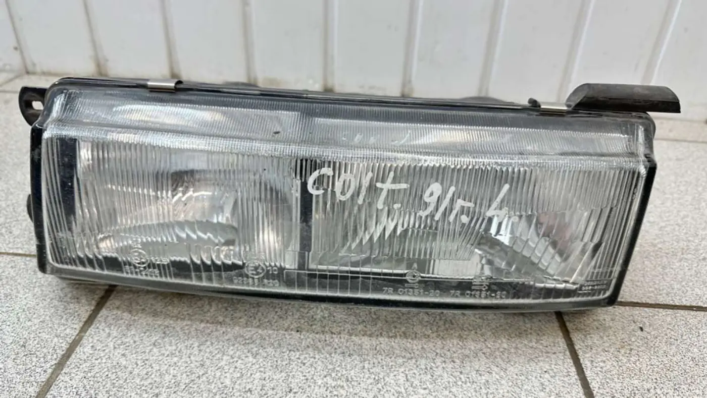 Фара левая к Mitsubishi Colt 1991