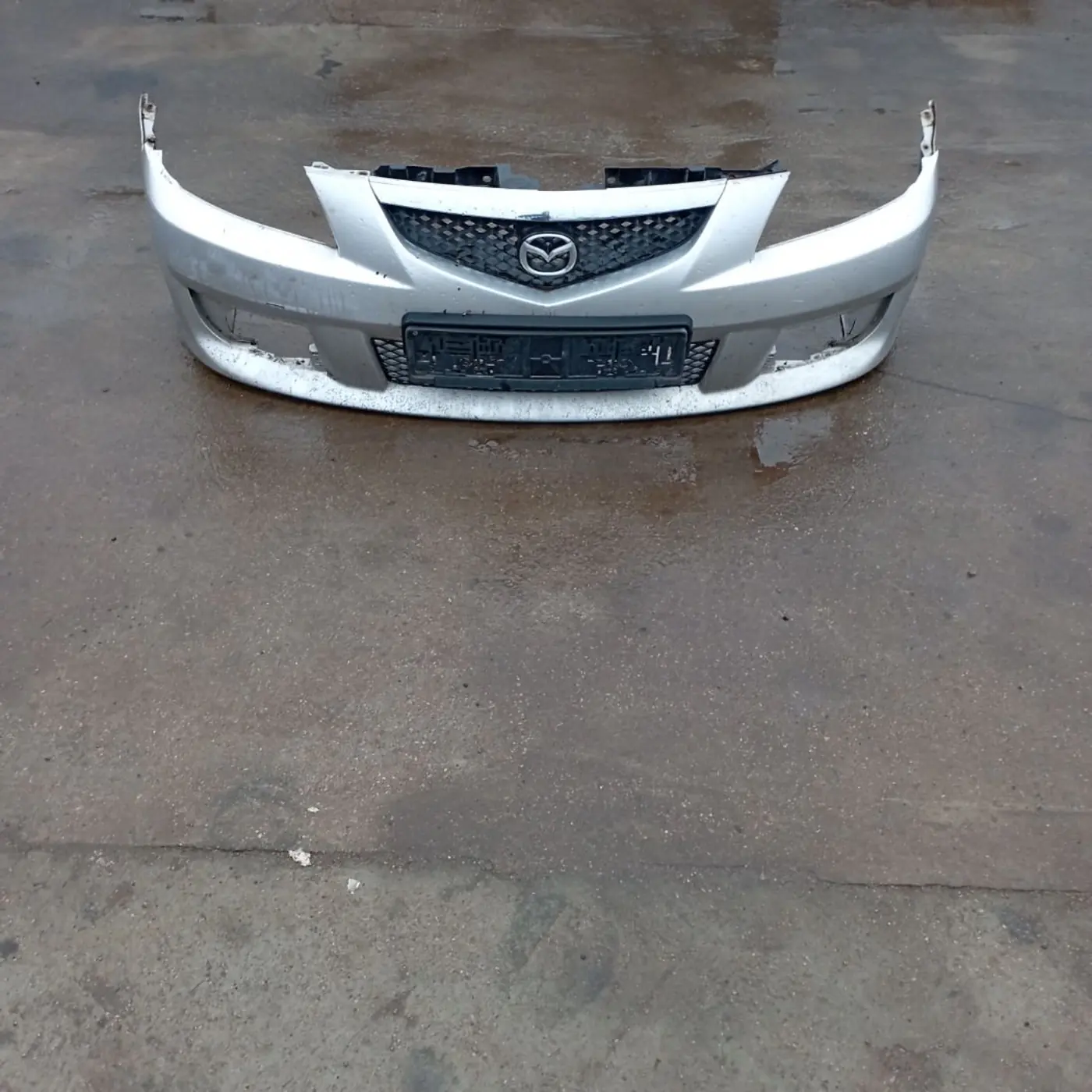 Бампер передний к Mazda Premacy 2001