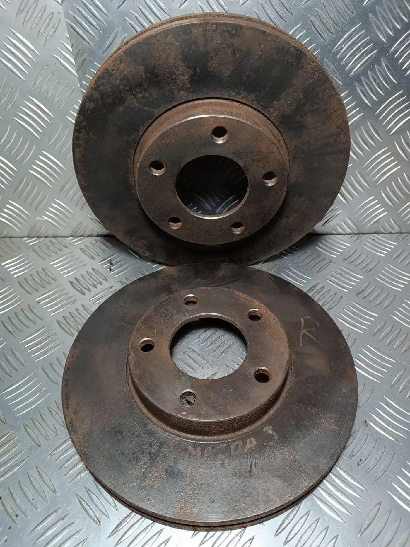 Диск тормозной передний к Mazda 3 2003