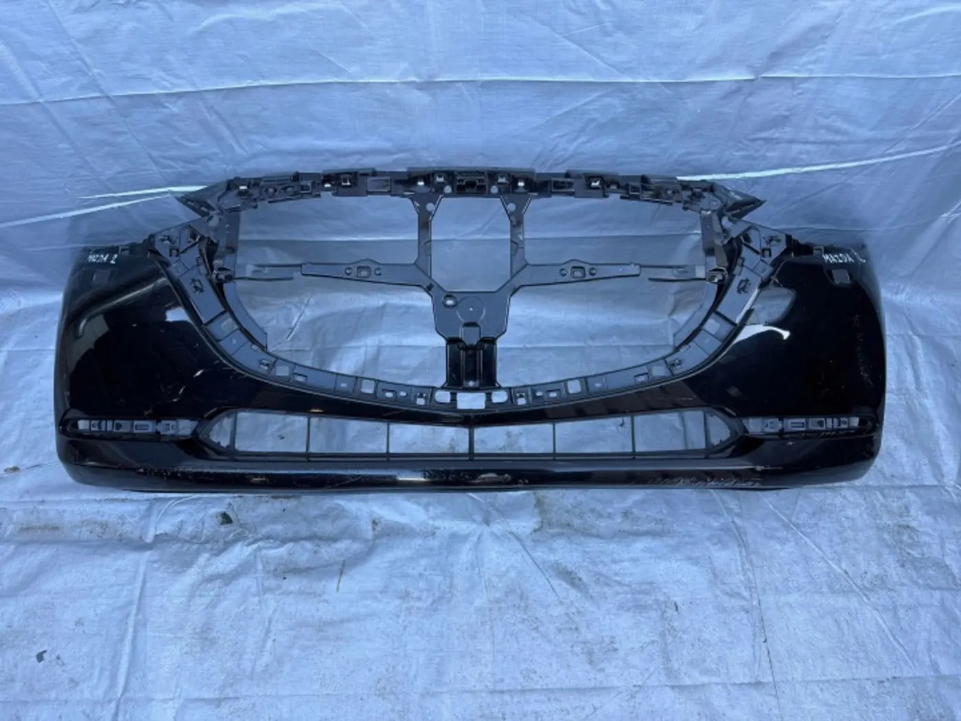 Бампер передний к Mazda Demio 2005