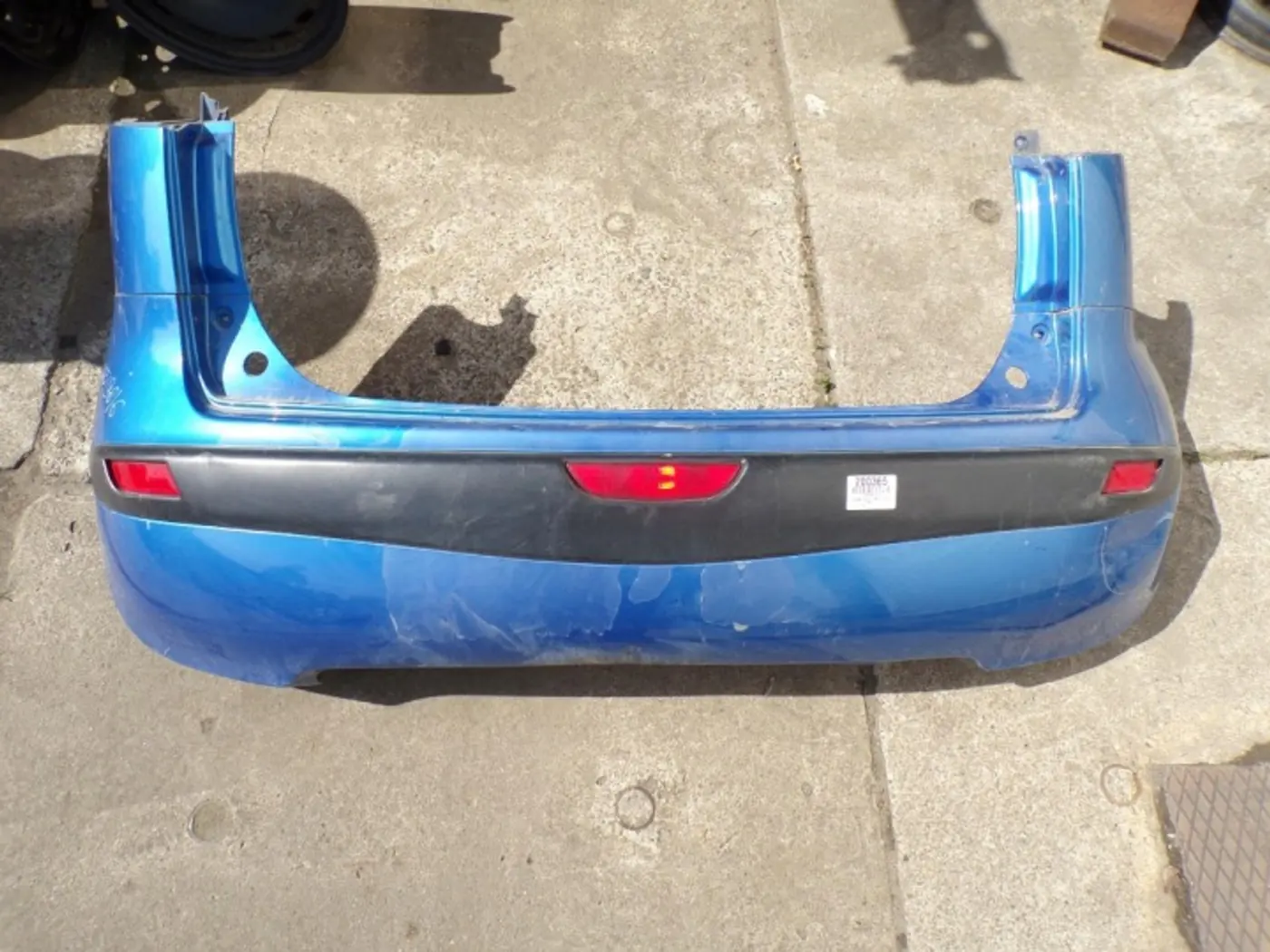 Бампер задний к Nissan Note 2005