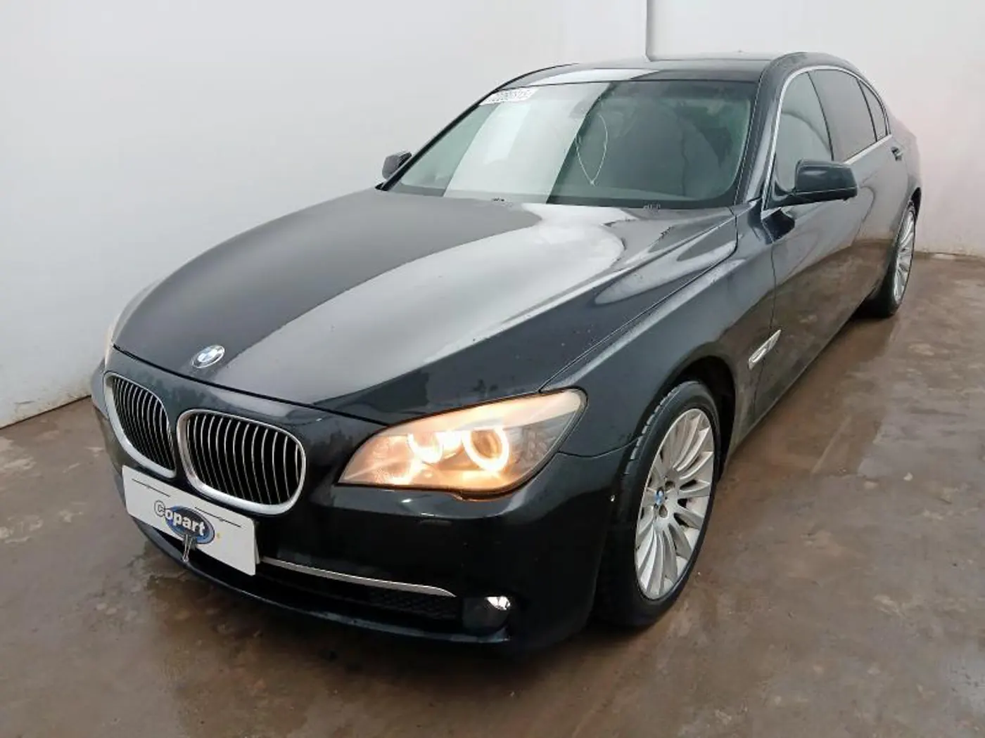 Суппорт задний левый к BMW 7 series 2010