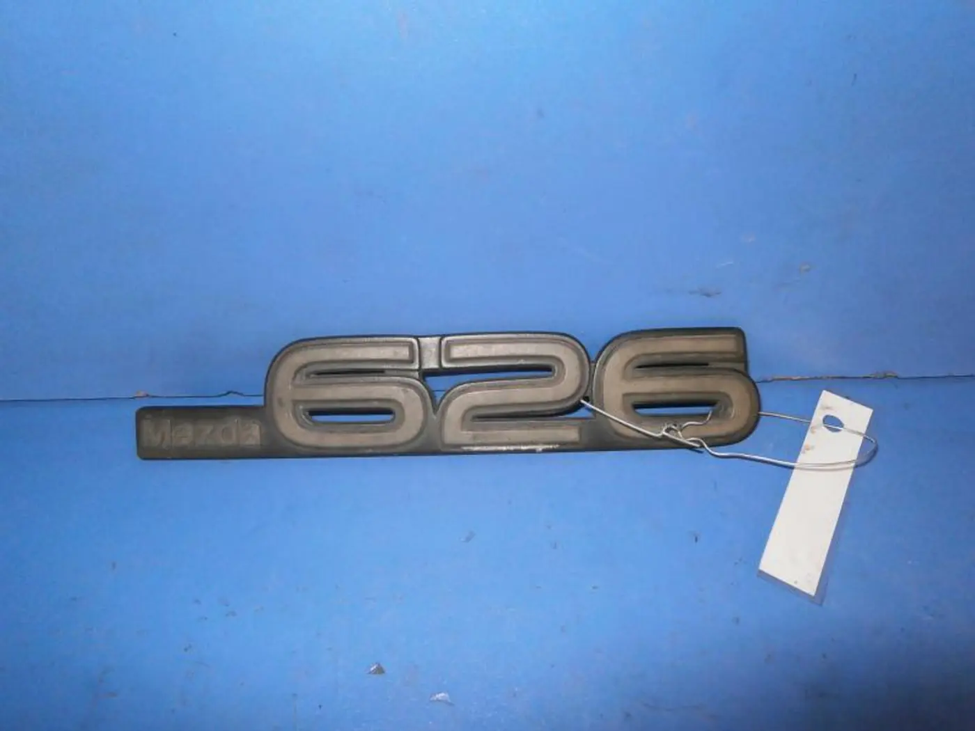 Эмблема к Mazda 626 1991