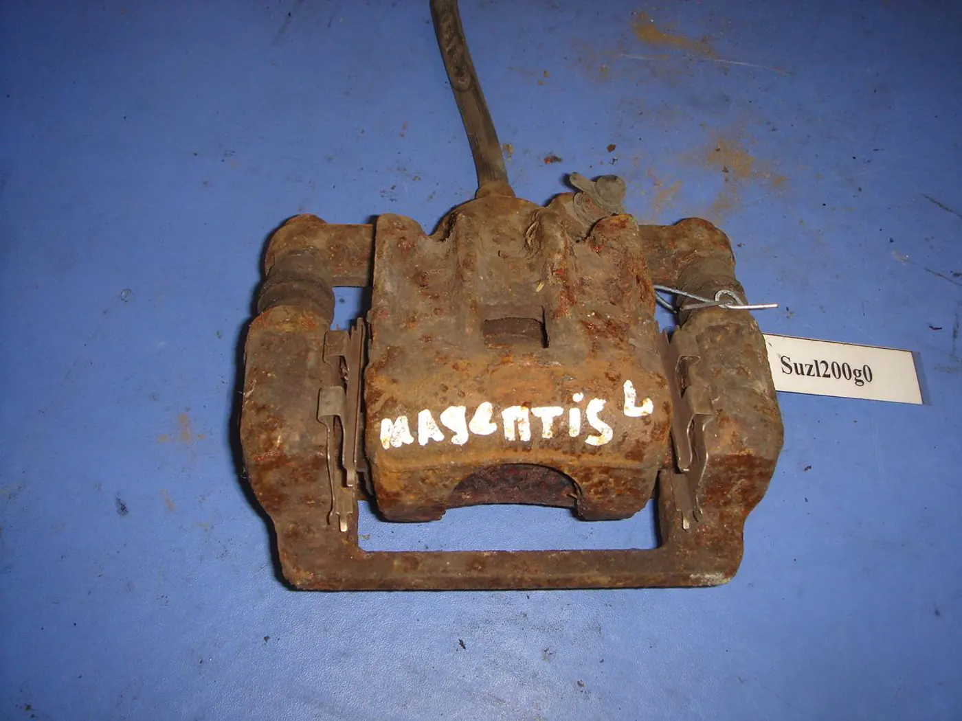 Суппорт задний левый к Kia Magentis 2003