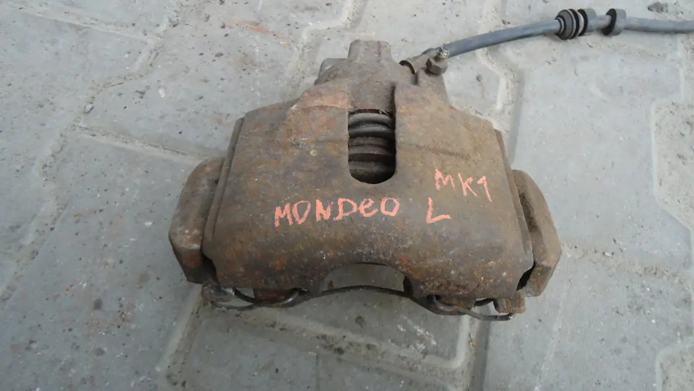 Суппорт передний левый к Ford Mondeo 1995