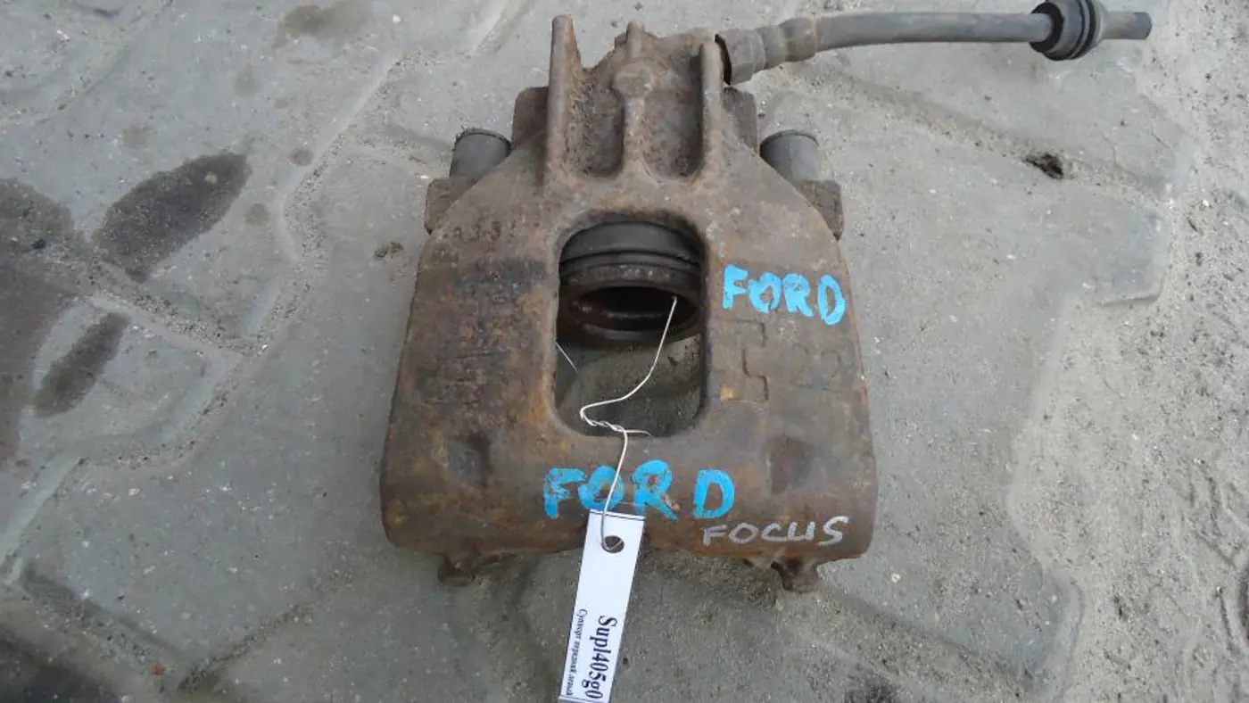 Суппорт передний левый к Ford Focus 2001