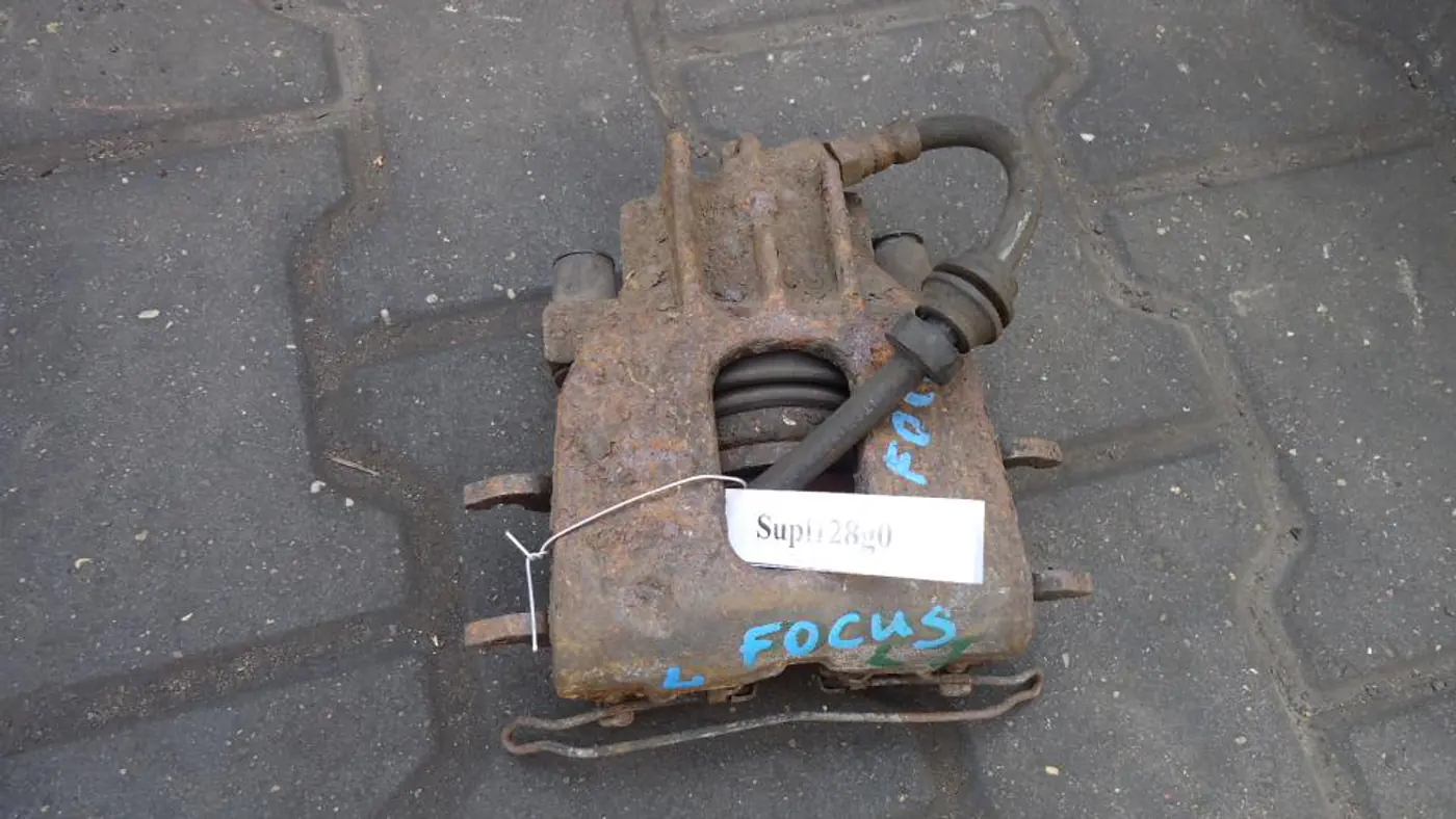 Суппорт передний левый к Ford Focus 1999