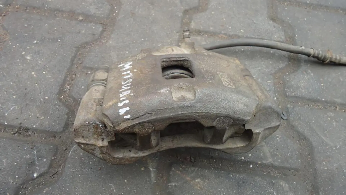 Суппорт передний левый к Mazda 626 1991