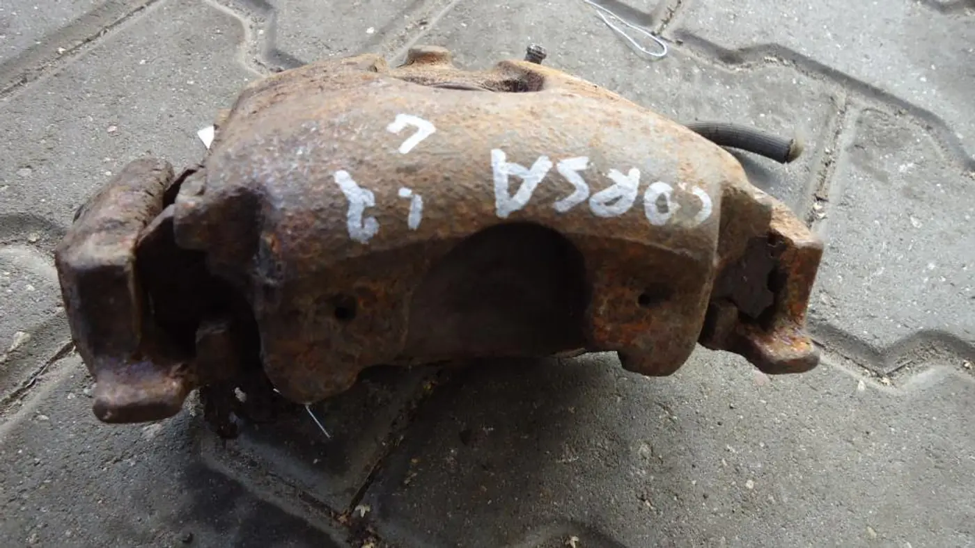 Суппорт передний левый к Opel Corsa 1997