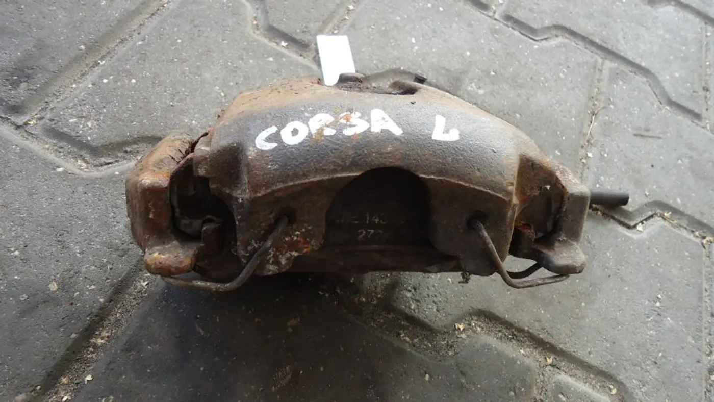 Суппорт передний левый к Opel Corsa 1996