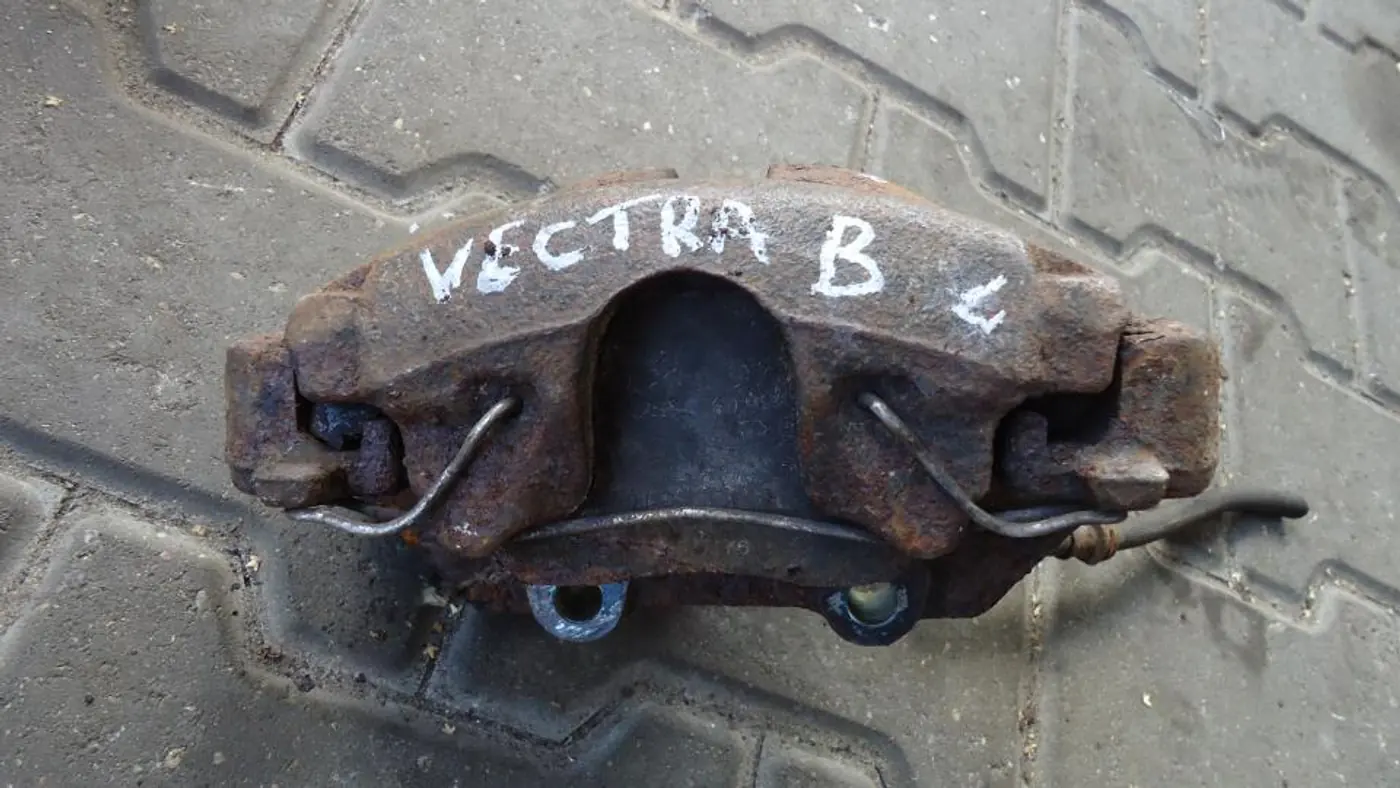 Суппорт передний левый к Opel Vectra 1997