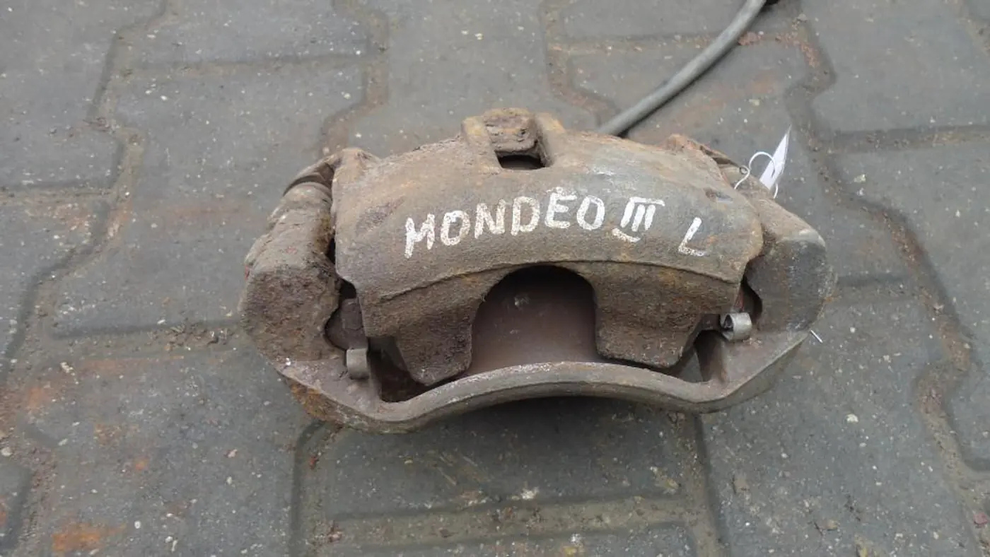 Суппорт передний левый к Ford Mondeo 2003