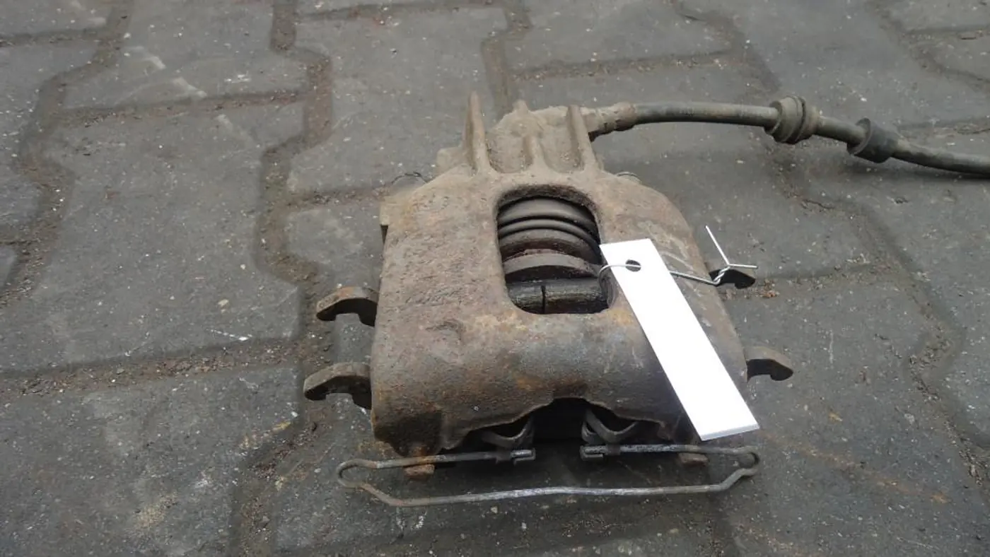 Суппорт передний левый к Ford Focus 1999