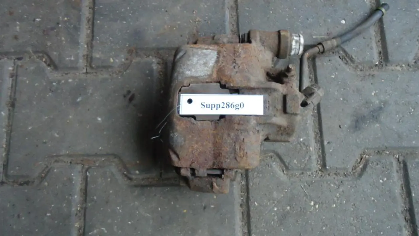 Суппорт передний правый к Ford Escort 1995