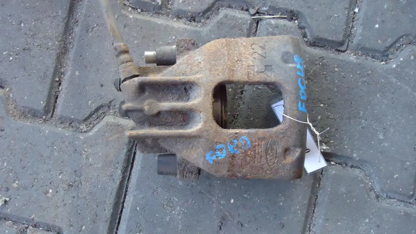 Суппорт передний левый к Ford Focus 1999