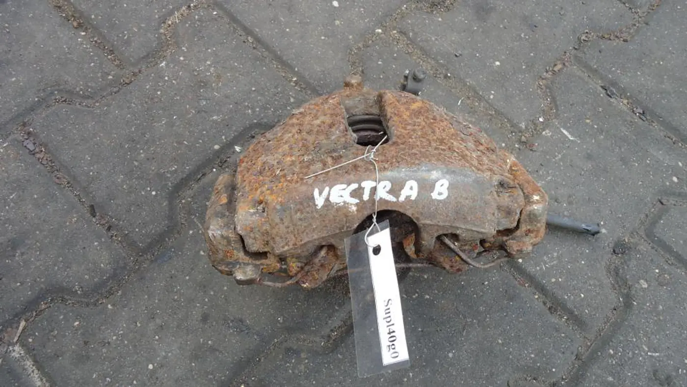 Суппорт передний левый к Opel Vectra 2000