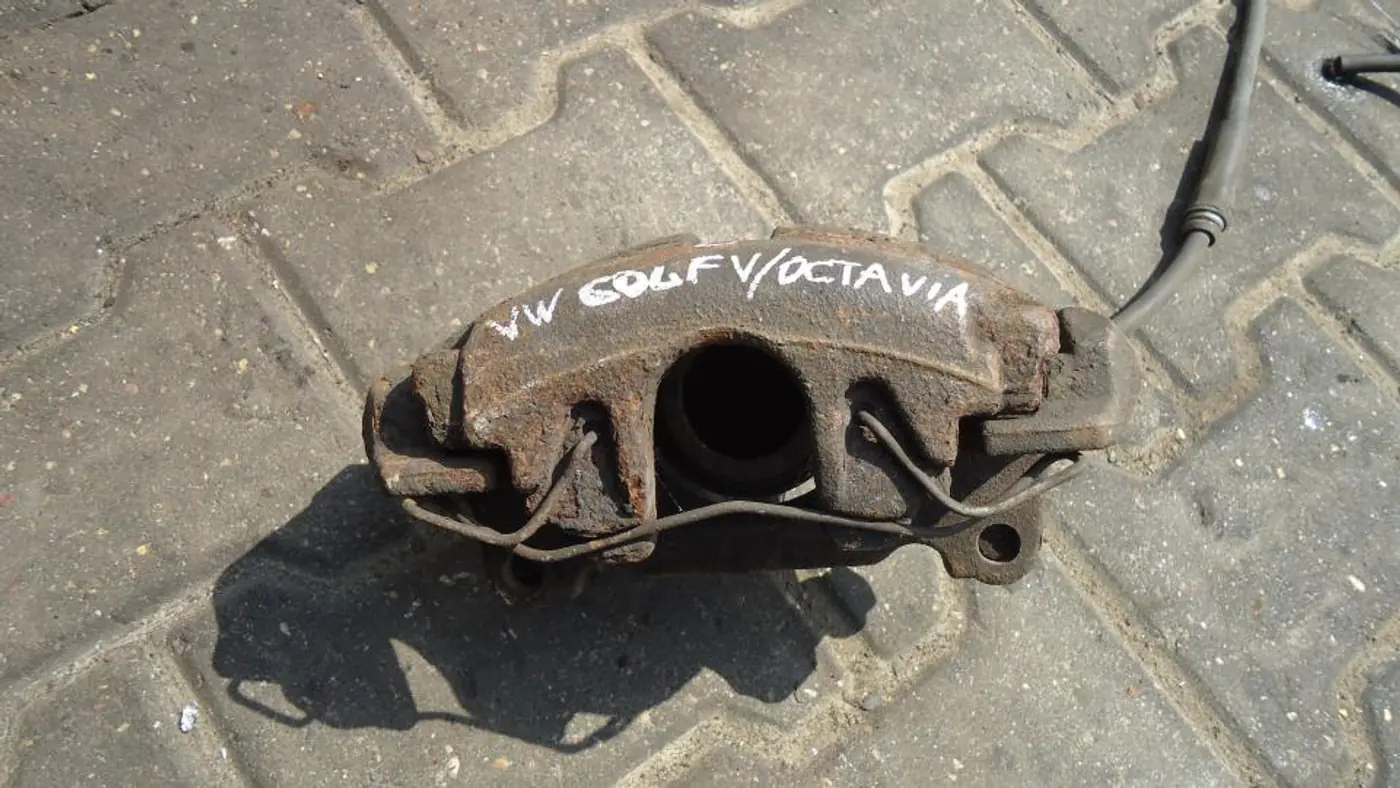 Суппорт передний левый к Volkswagen Golf 2006