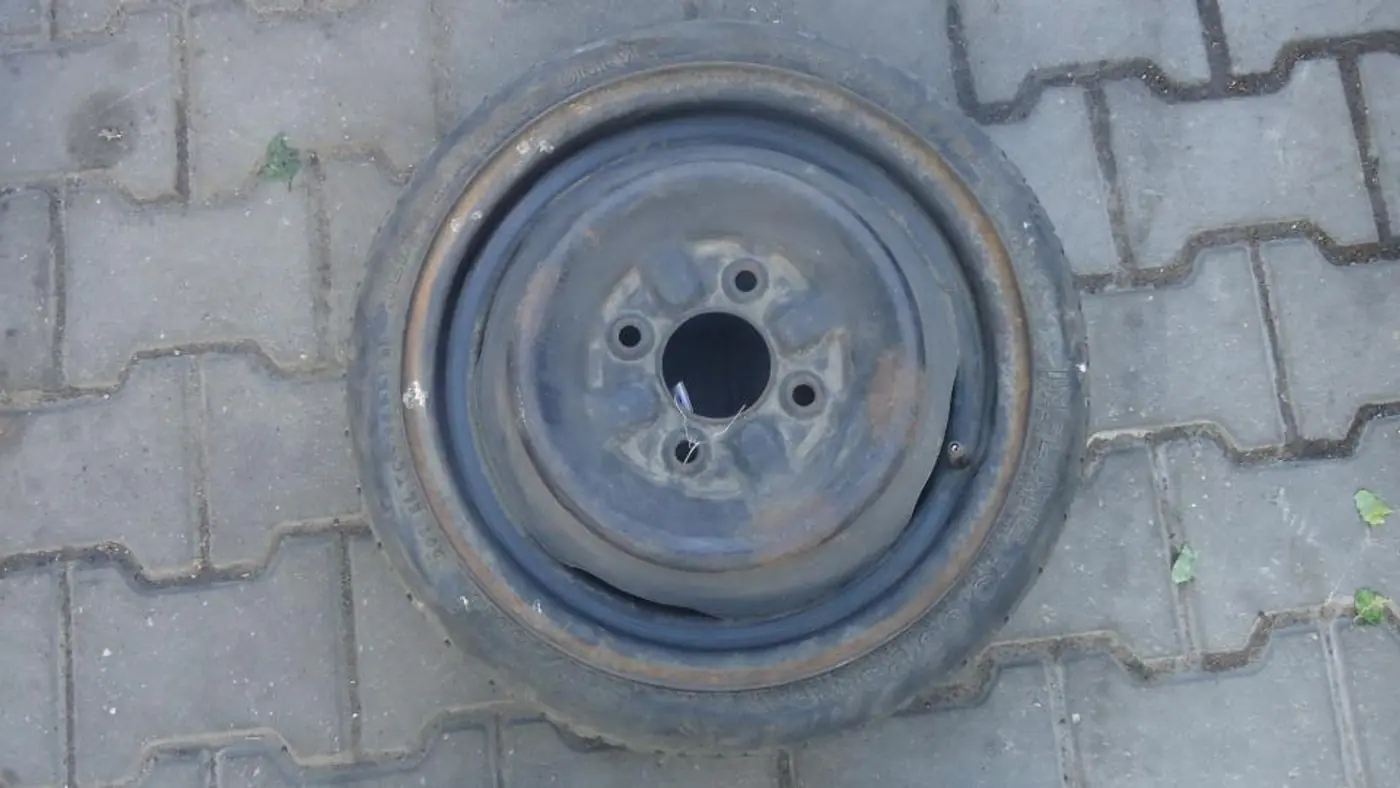 Колесо запасное (таблетка) к Mazda Demio 1999
